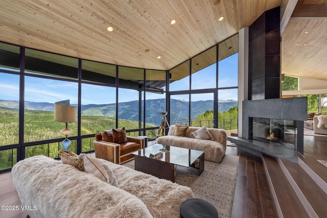 1268 Paintbrush, Avon, CO 81620 - living room with wood ceiling, a mountain view, a wall of windows, high vaulted ceiling, and hardwood / wood-style flooring