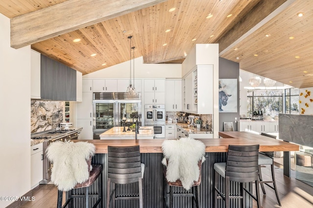 1268 Paintbrush, Avon, CO 81620 - kitchen with butcher block counters, appliances with stainless steel finishes, recessed lighting, backsplash, and wood finished floors