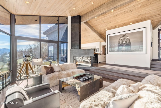 living room with high vaulted ceiling, floor to ceiling windows, wood-type flooring, wooden ceiling, and beamed ceiling