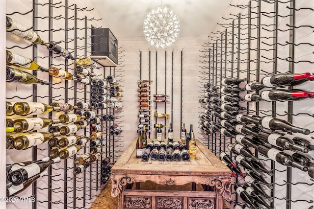 wine area with a notable chandelier