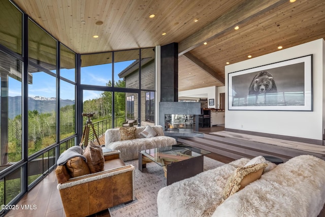 1268 Paintbrush, Avon, CO 81620 - living area with hardwood / wood-style floors, a wooden ceiling with exposed beams, high vaulted ceiling, a mountain view, and recessed lighting