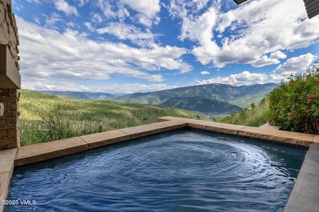 1268 Paintbrush, Avon, CO 81620 - view of pool with a mountain view and a hot tub
