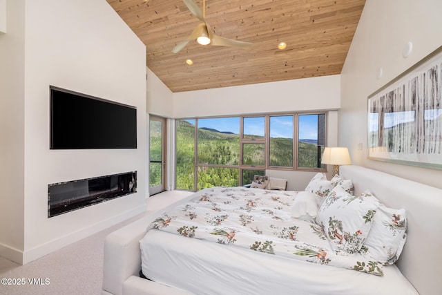1268 Paintbrush, Avon, CO 81620 - bedroom with wooden ceiling, high vaulted ceiling, carpet, a glass covered fireplace, and ceiling fan