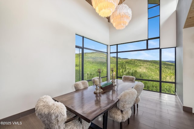 1268 Paintbrush, Avon, CO 81620 - dining area featuring expansive windows, a chandelier, and a mountain view