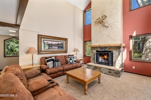 130 Grouse Ct Unit B, Avon, CO 81620 - living room with high vaulted ceiling, a fireplace, carpet, baseboards, and beam ceiling