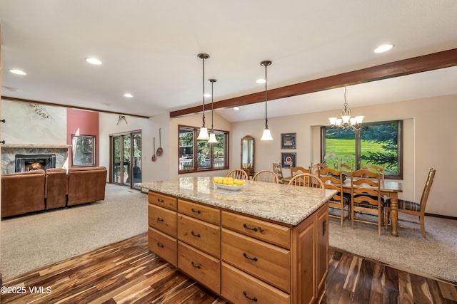130 Grouse Ct Unit B, Avon, CO 81620 - kitchen with a chandelier, dark wood-style floors, recessed lighting, a warm lit fireplace, and beamed ceiling
