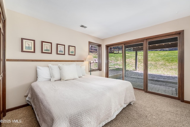 130 Grouse Ct Unit B, Avon, CO 81620 - bedroom with access to exterior, carpet floors, and baseboards
