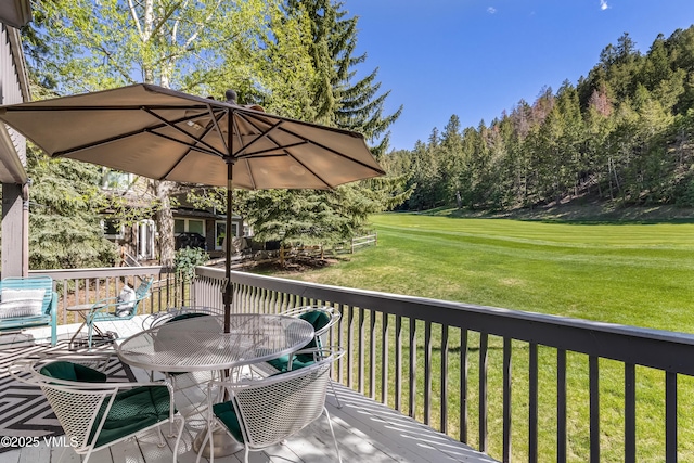 130 Grouse Ct Unit B, Avon, CO 81620 - wooden deck featuring a lawn and view of scattered trees