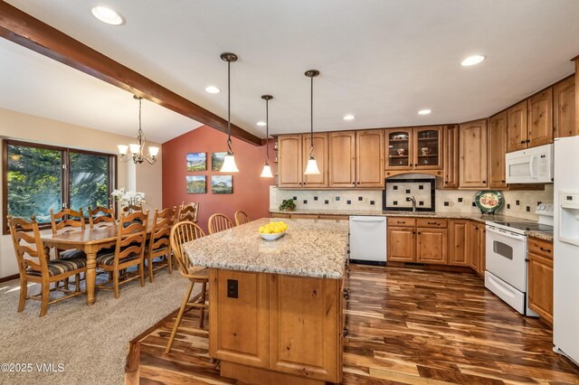 130 Grouse Ct Unit B, Avon, CO 81620 - kitchen featuring white appliances, recessed lighting, light stone counters, a chandelier, and backsplash