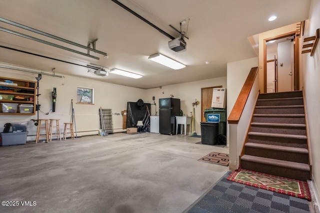225 Eagle Crest Rd, Edwards, CO 81632 - garage with freestanding refrigerator, a garage door opener, and recessed lighting