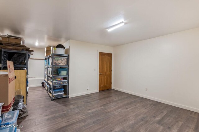 225 Eagle Crest Rd, Edwards, CO 81632 - basement featuring dark wood-style flooring and baseboards