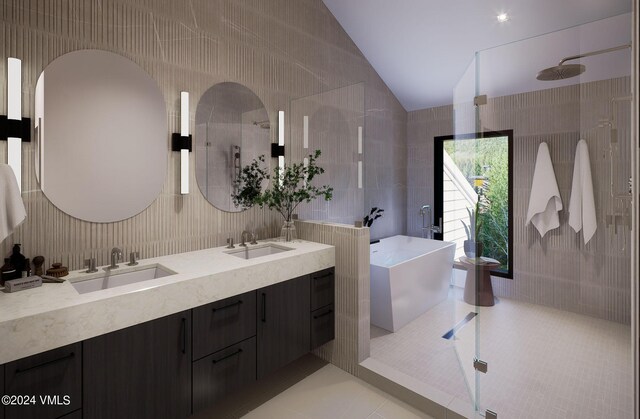 bathroom featuring vaulted ceiling, tile walls, tile patterned flooring, vanity, and walk in shower