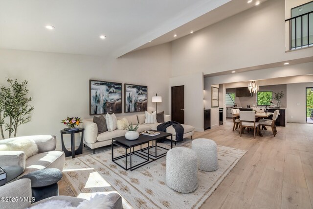 5074 Main Gore Dr S Unit B, Vail, CO 81657 - living area with light wood-type flooring, a chandelier, recessed lighting, and a towering ceiling