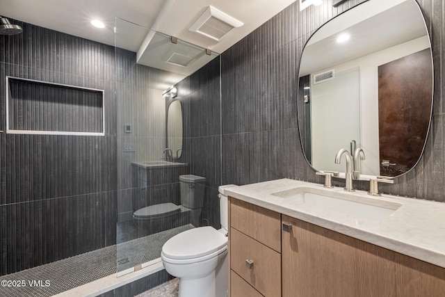 5074 Main Gore Dr S Unit B, Vail, CO 81657 - bathroom featuring vanity, a tile shower, and tile walls