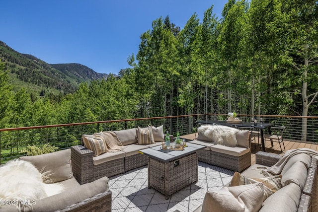 5074 Main Gore Dr S Unit B, Vail, CO 81657 - view of patio featuring a forest view, an outdoor hangout area, and a deck with mountain view