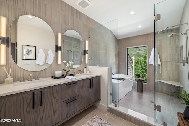 5074 Main Gore Dr S Unit B, Vail, CO 81657 - bathroom with double vanity, a freestanding tub, a stall shower, and tile patterned flooring