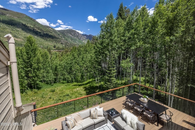 5074 Main Gore Dr S Unit B, Vail, CO 81657 - deck featuring an outdoor living space, a view of trees, and a mountain view