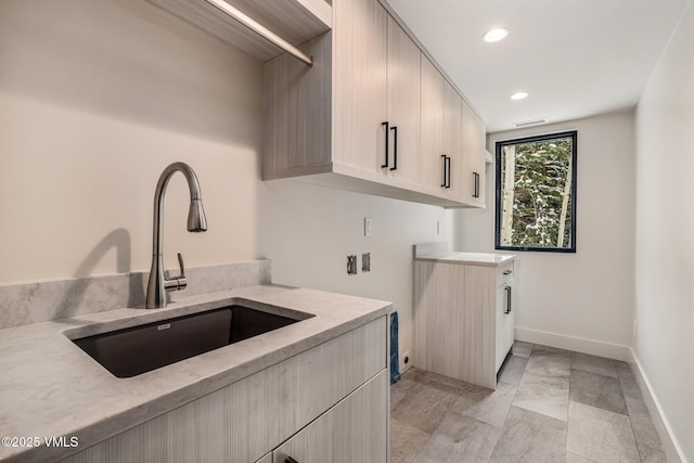 5074 Main Gore Dr S Unit B, Vail, CO 81657 - laundry room with cabinet space, recessed lighting, and light marble finish flooring