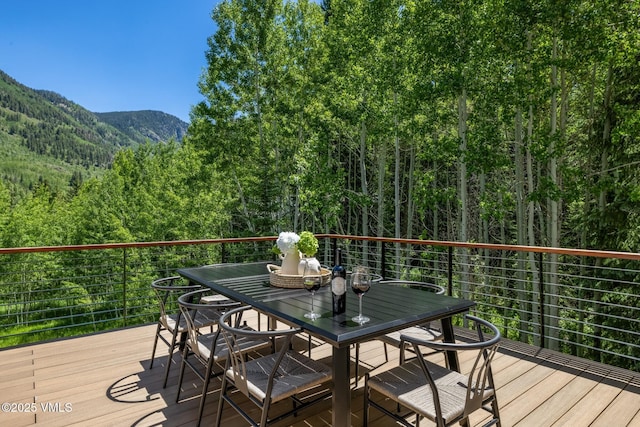 5074 Main Gore Dr S Unit B, Vail, CO 81657 - deck featuring a view of trees, a mountain view, and outdoor dining area