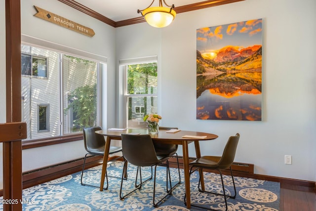 89 Columbine Cir Unit 2, Avon, CO 81620 - dining room with crown molding, wood finished floors, and a baseboard heating unit