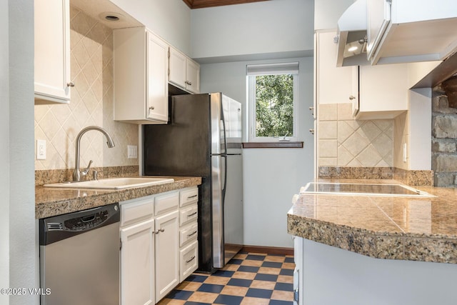 89 Columbine Cir Unit 2, Avon, CO 81620 - kitchen with stainless steel appliances, tile counters, light floors, white cabinets, and backsplash