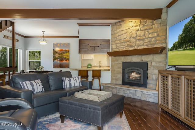 89 Columbine Cir Unit 2, Avon, CO 81620 - living area with wood finished floors, a fireplace, and crown molding