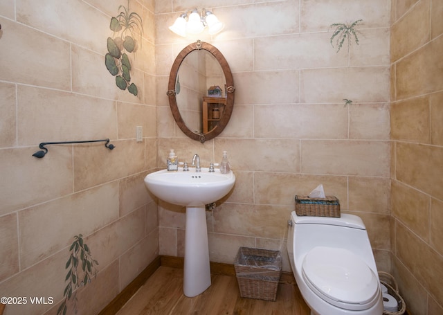 4030 Bighorn Rd Lot 1-B, Vail, CO 81657 - bathroom featuring wood finished floors, toilet, and tile walls