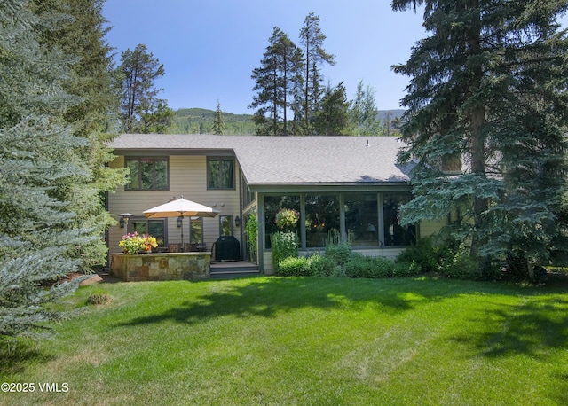 4030 Bighorn Rd Lot 1-B, Vail, CO 81657 - rear view of house featuring a lawn and roof with shingles