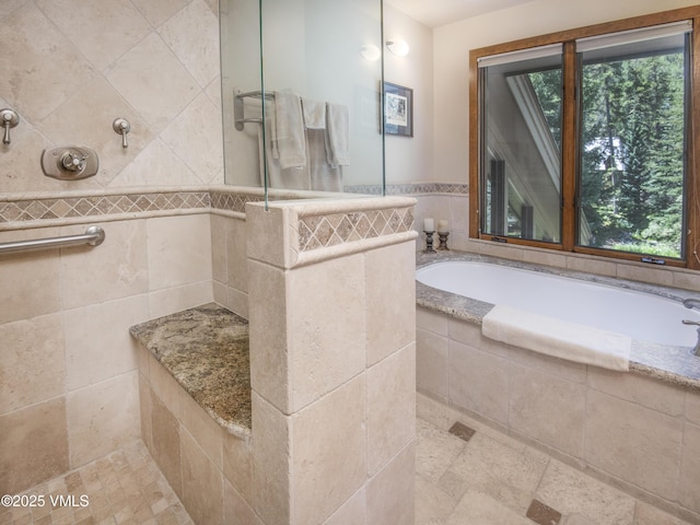 4030 Bighorn Rd Lot 1-B, Vail, CO 81657 - bathroom with healthy amount of natural light, tiled shower, and a garden tub