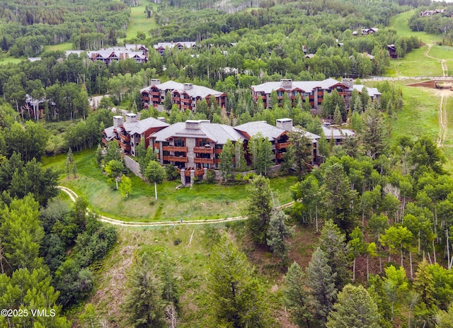 320 Hummingbird Dr Unit A201, Avon, CO 81620 - aerial overview of property's location with a heavily wooded area