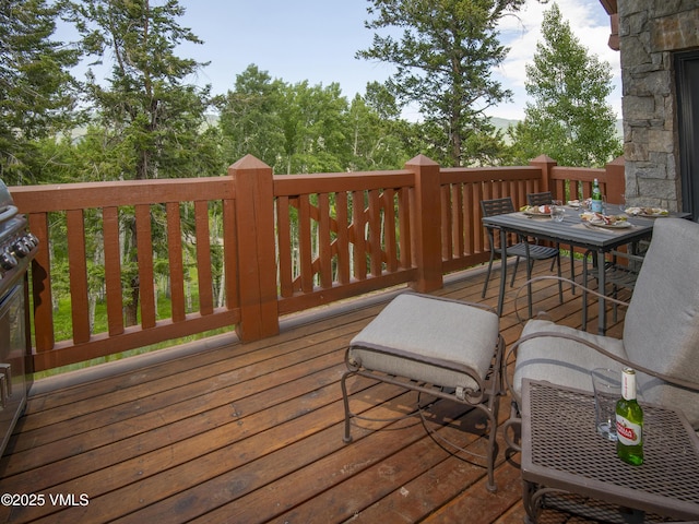 320 Hummingbird Dr Unit A201, Avon, CO 81620 - wooden deck featuring outdoor dining space
