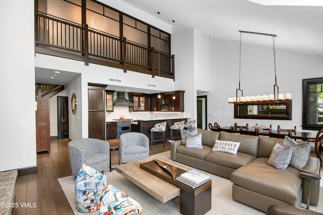 320 Hummingbird Dr Unit A201, Avon, CO 81620 - living area featuring high vaulted ceiling and hardwood / wood-style floors
