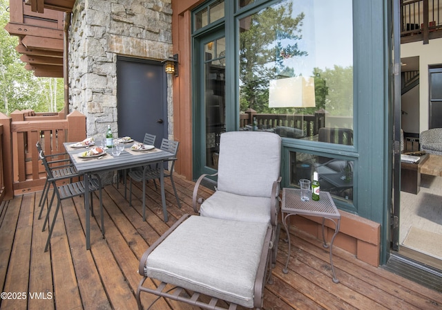 320 Hummingbird Dr Unit A201, Avon, CO 81620 - wooden terrace with outdoor dining area