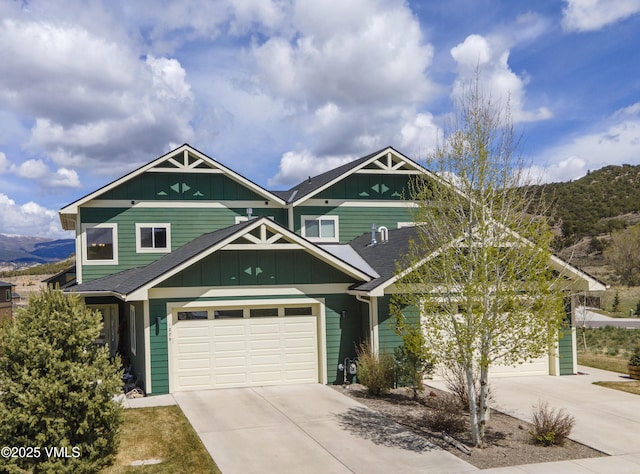 1275 Hawks Nest Ln, Gypsum, CO 81637 - craftsman-style house with a shingled roof, board and batten siding, a mountain view, and concrete driveway