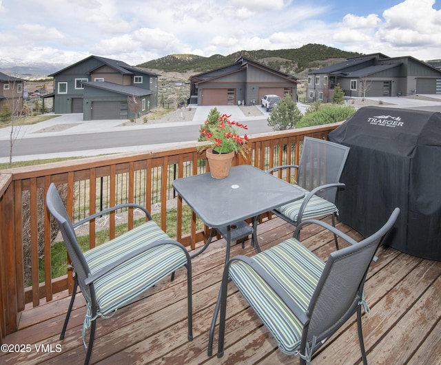 1275 Hawks Nest Ln, Gypsum, CO 81637 - wooden terrace featuring a mountain view, a residential view, and area for grilling