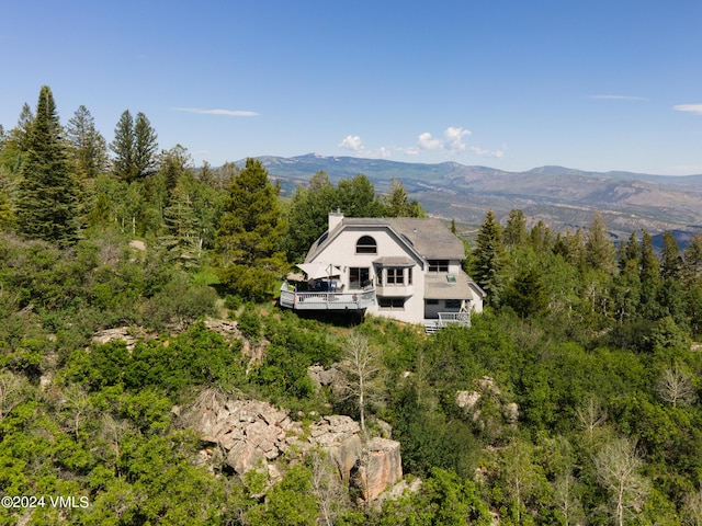 birds eye view of property featuring a mountain view