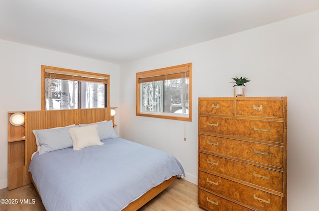 1610 Buffehr Creek Rd Unit A-22, Vail, CO 81657 - bedroom featuring light wood finished floors and baseboards