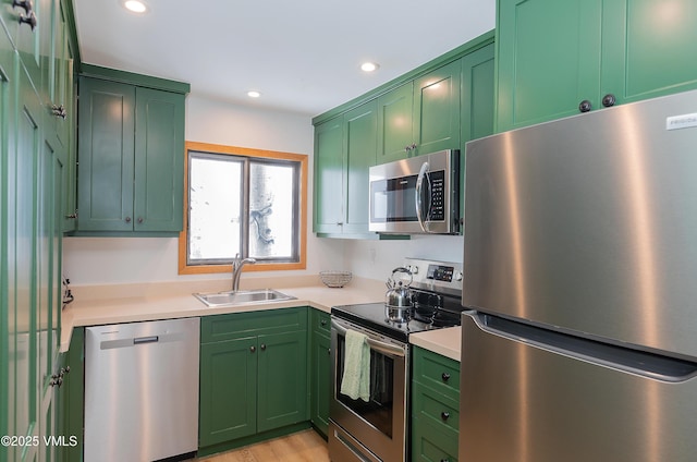 1610 Buffehr Creek Rd Unit A-22, Vail, CO 81657 - kitchen featuring stainless steel appliances, green cabinets, recessed lighting, light countertops, and light wood-style floors