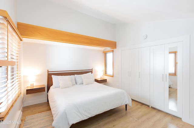 1610 Buffehr Creek Rd Unit A-22, Vail, CO 81657 - bedroom featuring light wood finished floors, lofted ceiling, and a closet