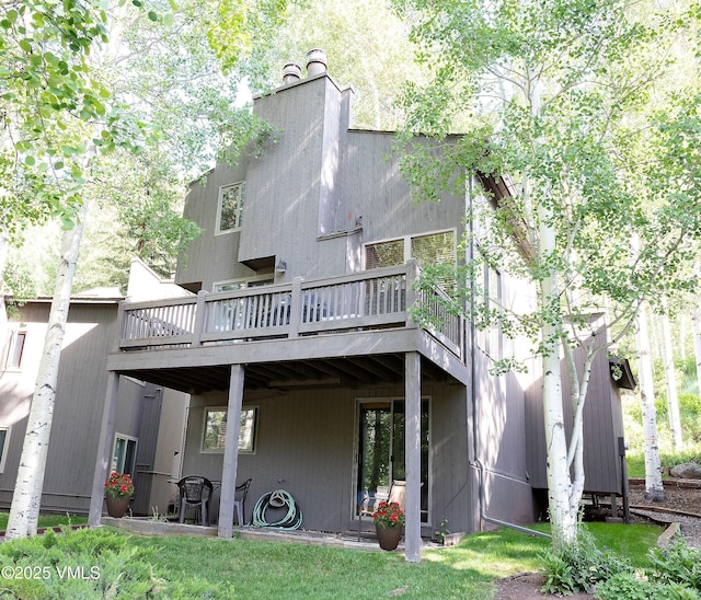 1610 Buffehr Creek Rd Unit A-22, Vail, CO 81657 - rear view of property featuring a wooden deck