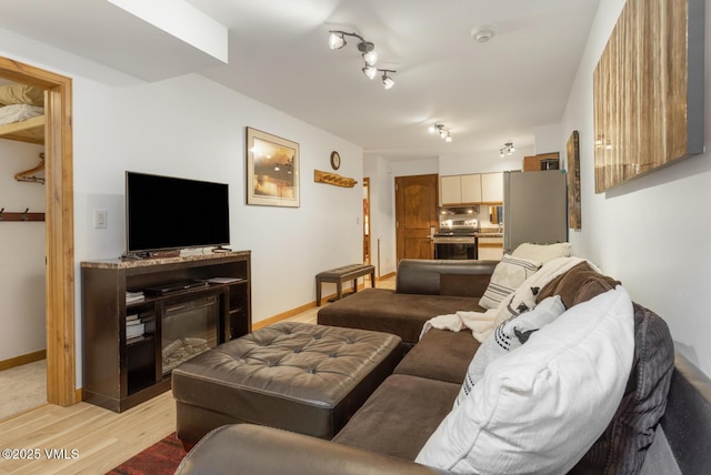 660 Lionshead Pl Unit 29, Vail, CO 81658 - living room with light wood-type flooring and baseboards