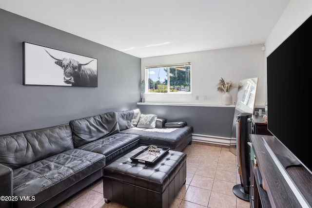 living room featuring light tile patterned flooring and a baseboard radiator