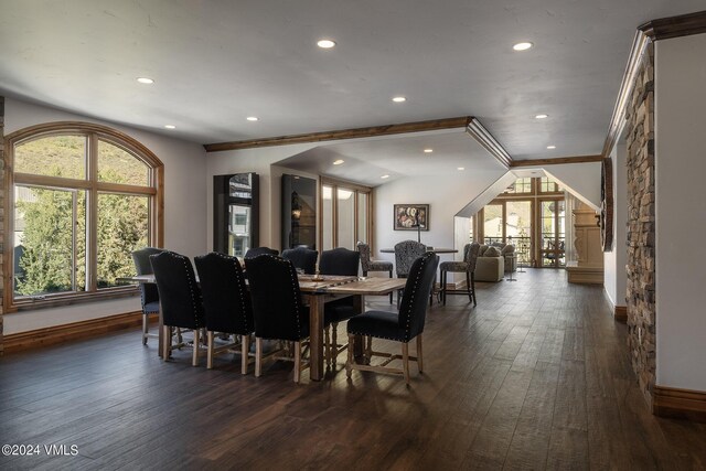 dining space featuring ornamental molding and dark hardwood / wood-style floors