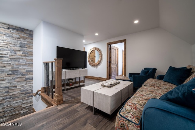 living room featuring lofted ceiling and dark hardwood / wood-style floors