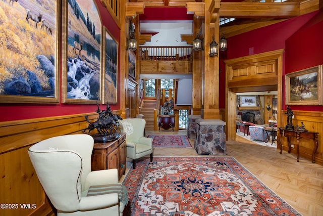 interior space featuring stairway, wood walls, and a fireplace