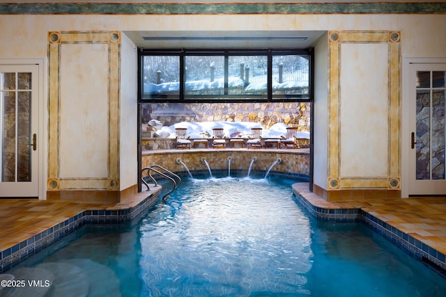 indoor pool featuring a hot tub