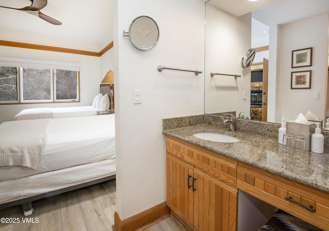 120 Offerson Rd Unit D330, Beaver Creek, CO 81620 - bathroom featuring connected bathroom, wood finished floors, vanity, and ceiling fan