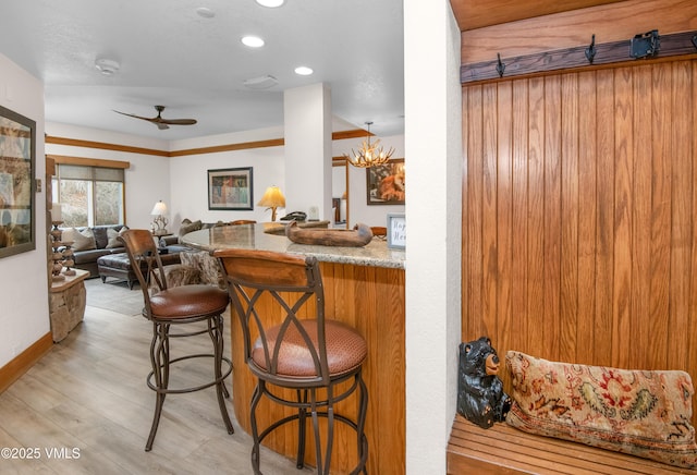 120 Offerson Rd Unit D330, Beaver Creek, CO 81620 - kitchen with a ceiling fan, a kitchen bar, light wood-style floors, recessed lighting, and open floor plan