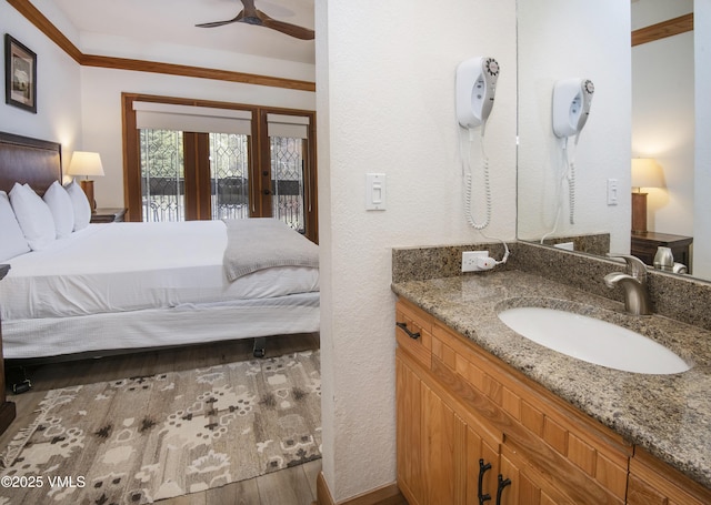 120 Offerson Rd Unit D330, Beaver Creek, CO 81620 - bathroom featuring french doors, ceiling fan, wood finished floors, vanity, and a textured wall