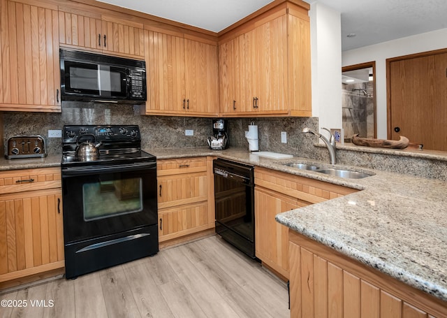 120 Offerson Rd Unit D330, Beaver Creek, CO 81620 - kitchen featuring black appliances, a sink, light stone countertops, and backsplash